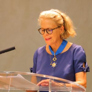 Helene Dollfus speaking at a podium on receipt of her award.